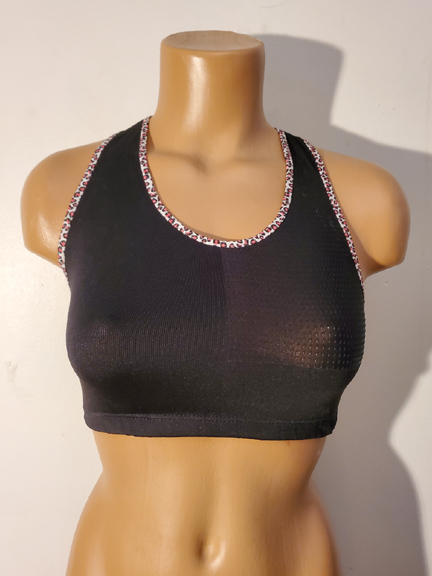 Black cropped tank top with animal print trim.